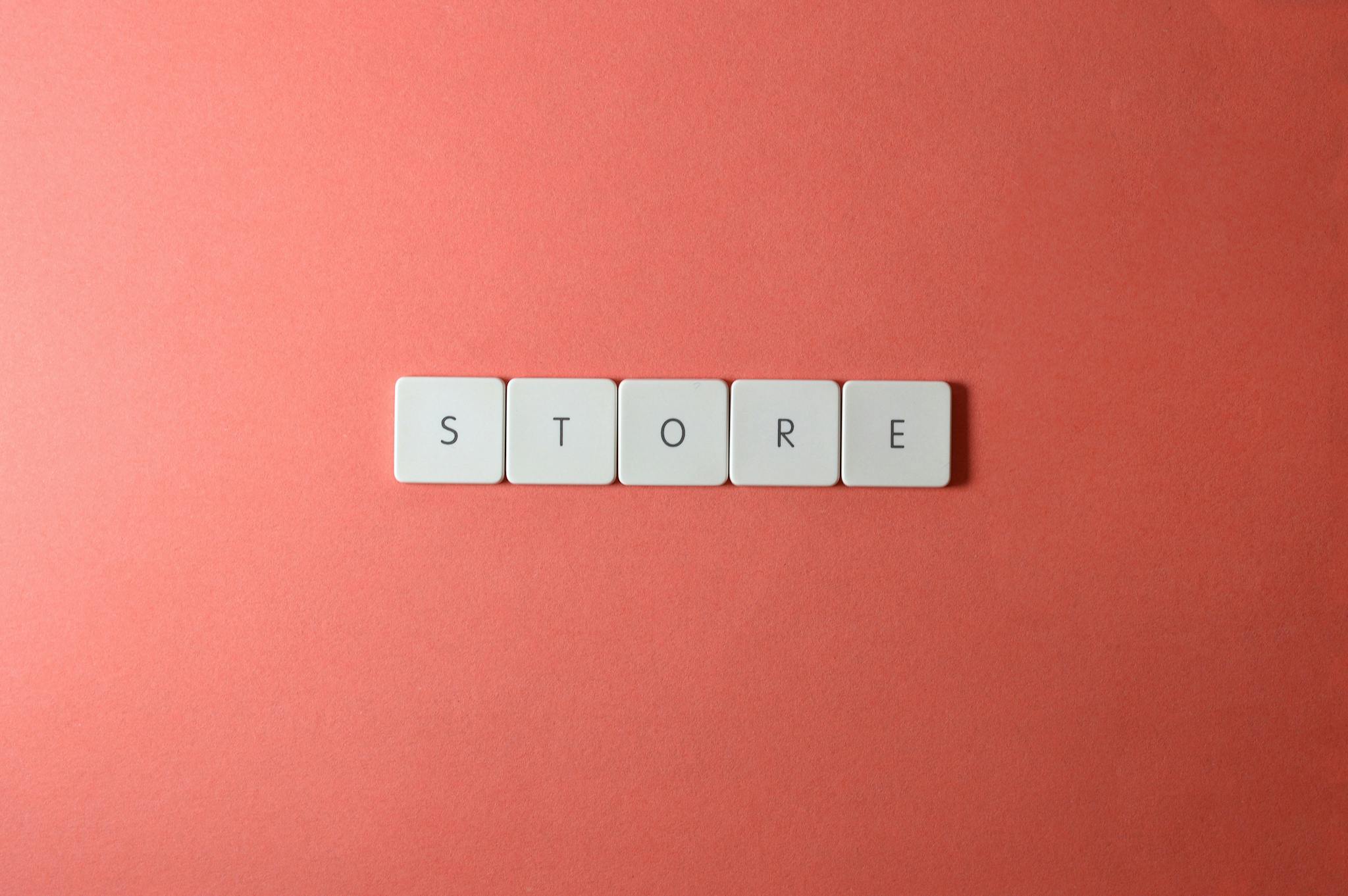 Minimalist conceptual image with 'STORE' spelled out on a red background, perfect for ecommerce themes.